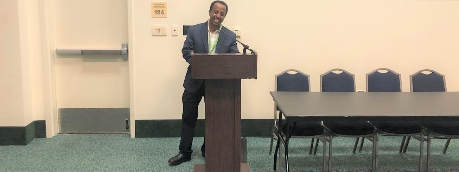 Dr. Abeneazer Urga prepares to present a paper at a meeting of the Evangelical Theological Society (ETS)