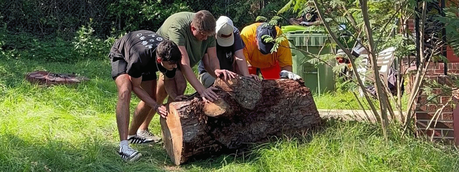 CIU students add muscle power to their clean-up efforts in the nearby Denny Terrace neighborhood. 