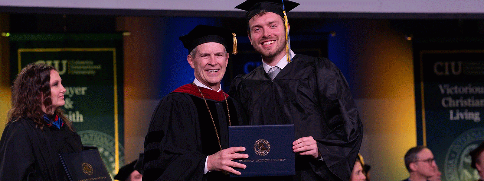 Brandon Lee congratulated on graduation day by CIU President Dr. Bill Jones (Photo by Noah Allard)