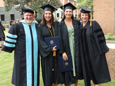Graduates of the CIU Education program celebrate with professors. 