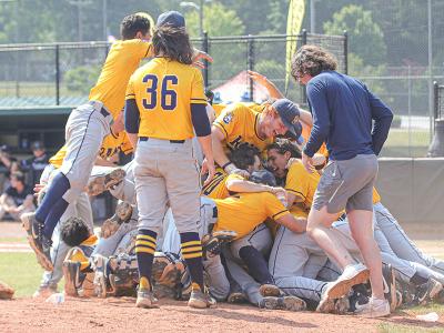 The Rams celebrate after the final out. 