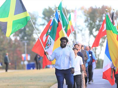 International student Deandre Leith of Jamaica carries his nation's flag. "I know my calling is to be an evangelist," says Leith. 