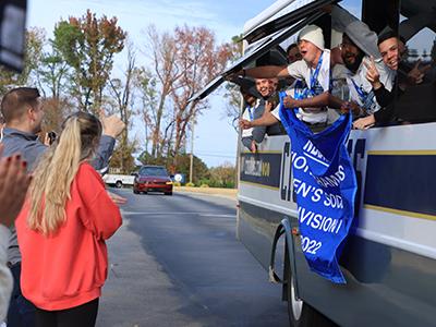 CIU students greet the team bus as it arrives on campus. (Photo by Kierston Smith)