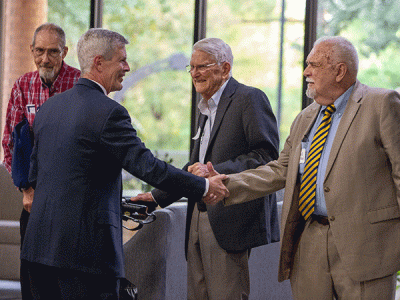 New CIU President Dr. Bill Jones greets CIU alumnus William "Dennis" Wallace ('75), as Dick McCloy ('63) (on left) and Bill Harding ('50) look on. (Photo by Seth Berry)  