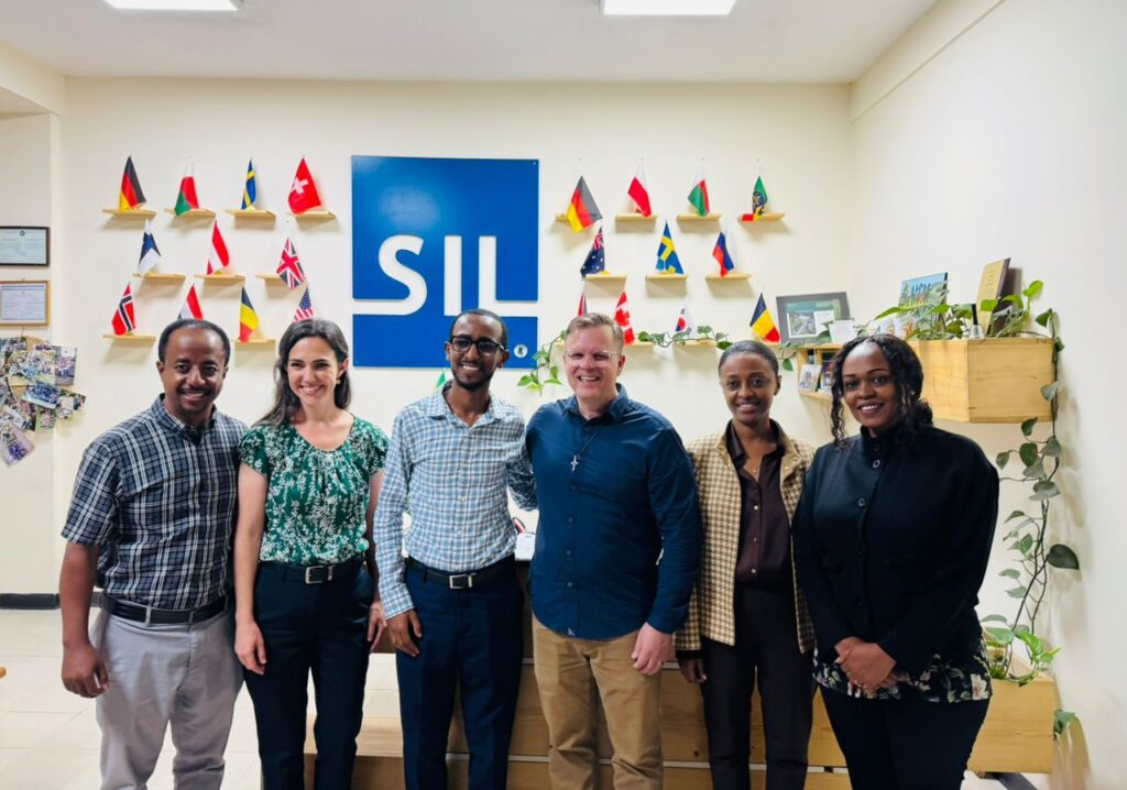 Dr. Ed Smither poses with CIU students and alumni serving on the SIL Ethiopia team in Addis Ababa, Ethiopia