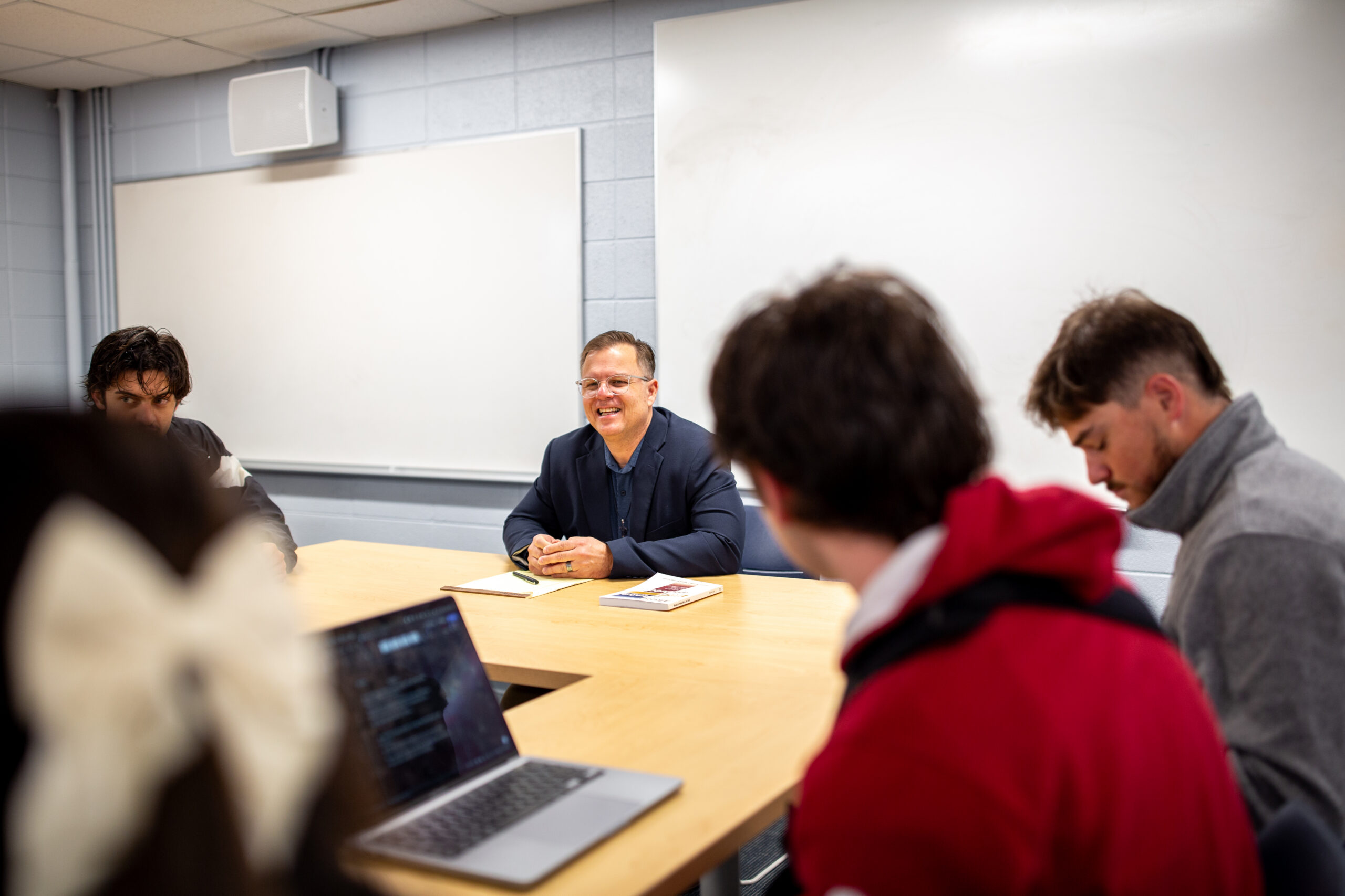 Dr. Smither teaches a senior capstone class for intercultural studies at Columbia International University, engaging students in discussion.