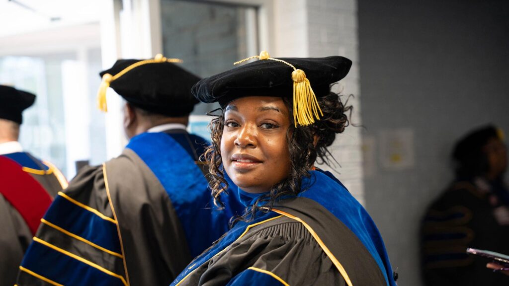 CIU candidates for graduation walk to Shortess Chapel