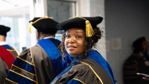 CIU candidates for graduation walk to Shortess Chapel