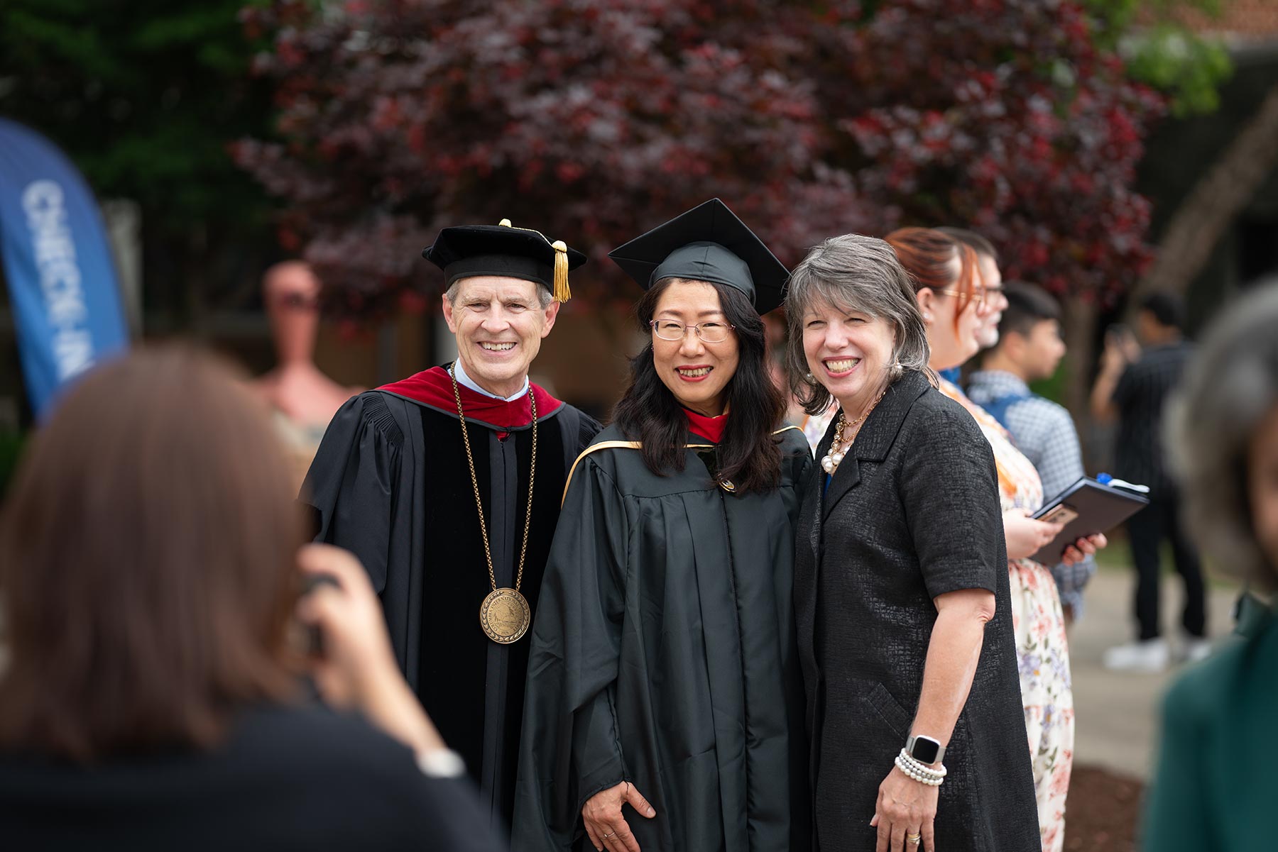 President Bill and Debbie Jones with a graduate