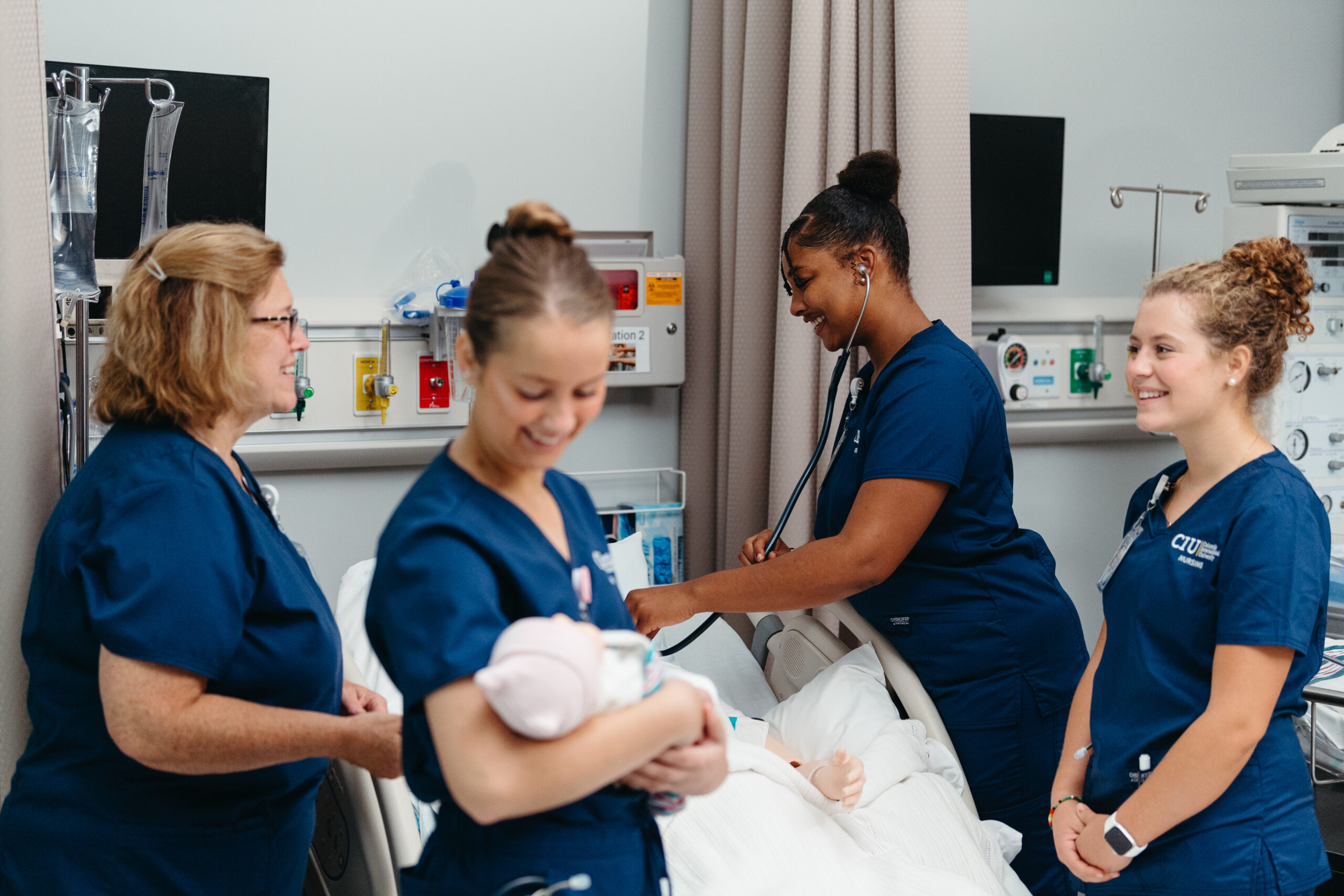 CIU nursing students practice patient care in the Simulation Lab with hands-on training and faculty guidance.