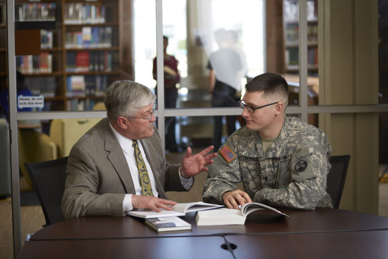 Dr. Langston meets with a CIU military student, reflecting mentorship and preparation for military chaplaincy.