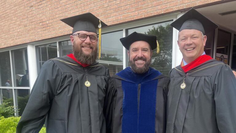 Dr. David Croteau celebrates with Engage graduates.