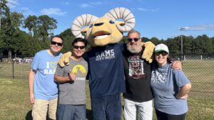 Grad Life Council with cheer at CIU Rams soccer match.
