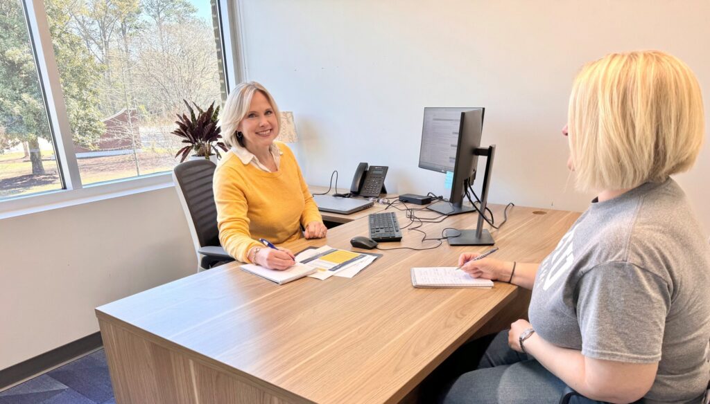 Holly Cole, Director of Academic Advising at Columbia International University, meets one-on-one with a transfer student to review academic plans and transfer credits