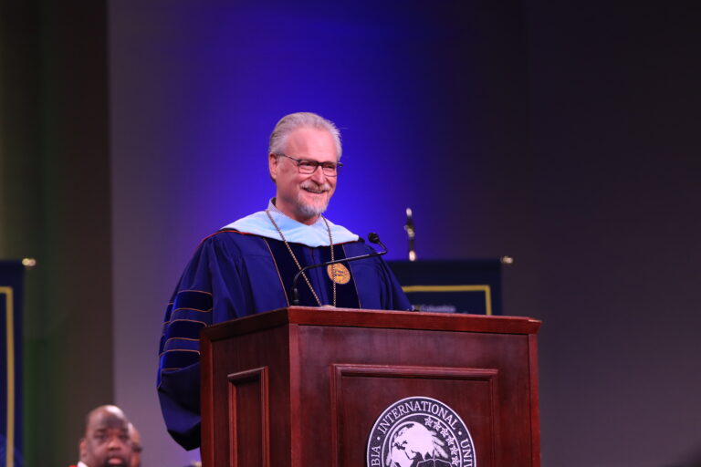 Dr. Rick Christman speaking on stage at Columbia International University’s Commencement.