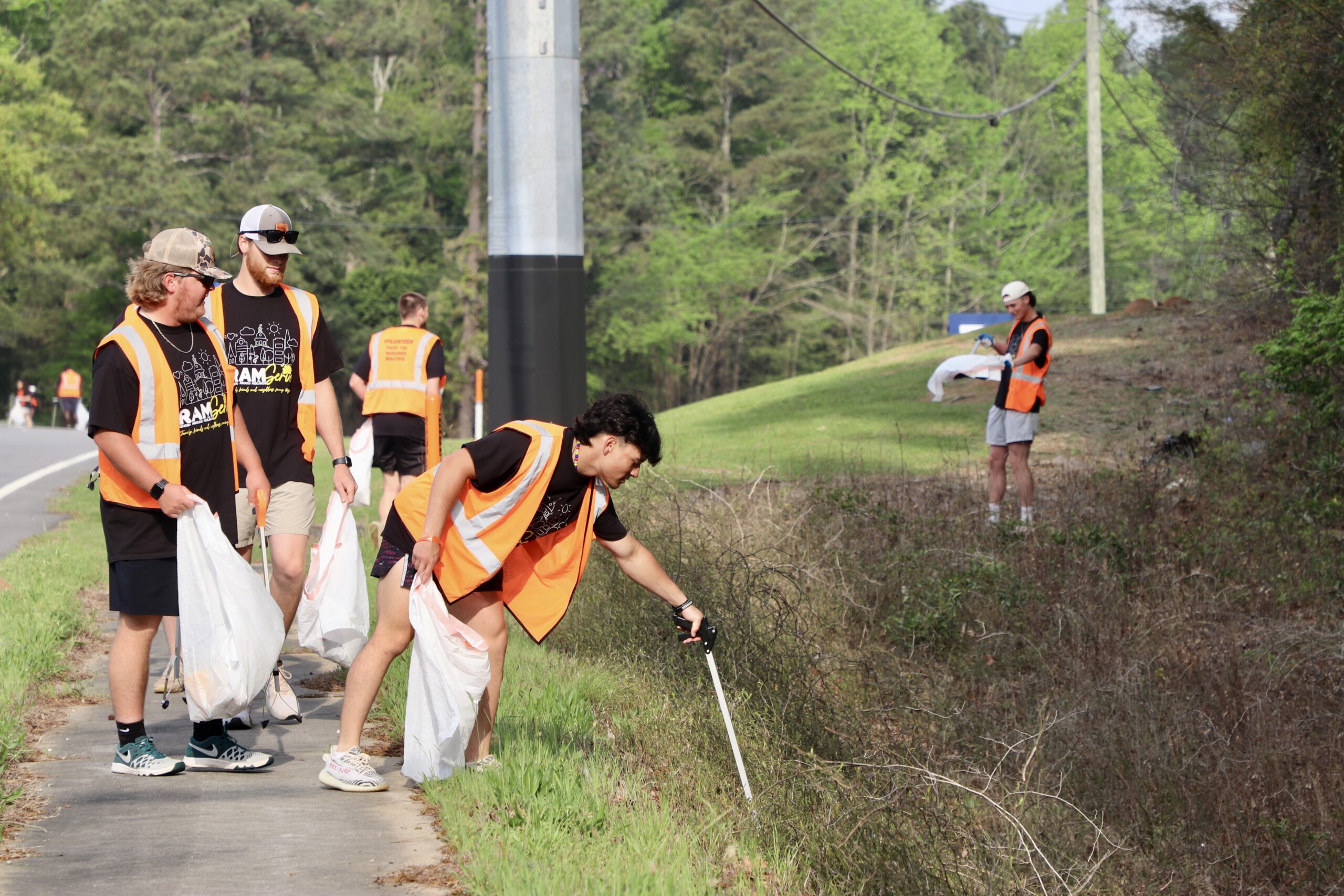 RAM Serve Students cleaning up the road during RAM Serve